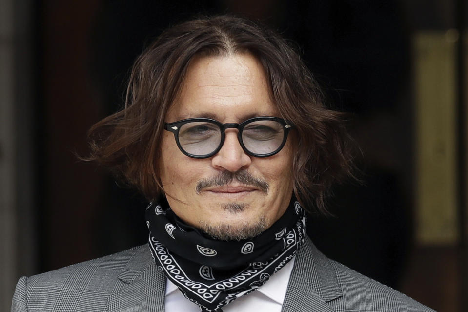 American actor Johnny Depp poses for the media as he arrives at the High Court in London, Monday, July 13, 2020. Depp is expected to wrap up his evidence at his libel trial against a tabloid newspaper that accused him of abusing ex-wife Amber Heard. The Hollywood star is suing News Group Newspapers, publisher of The Sun, and the paper’s executive editor, Dan Wootton, over an April 2018 article that called him a “wife-beater.” (AP Photo/Matt Dunham)