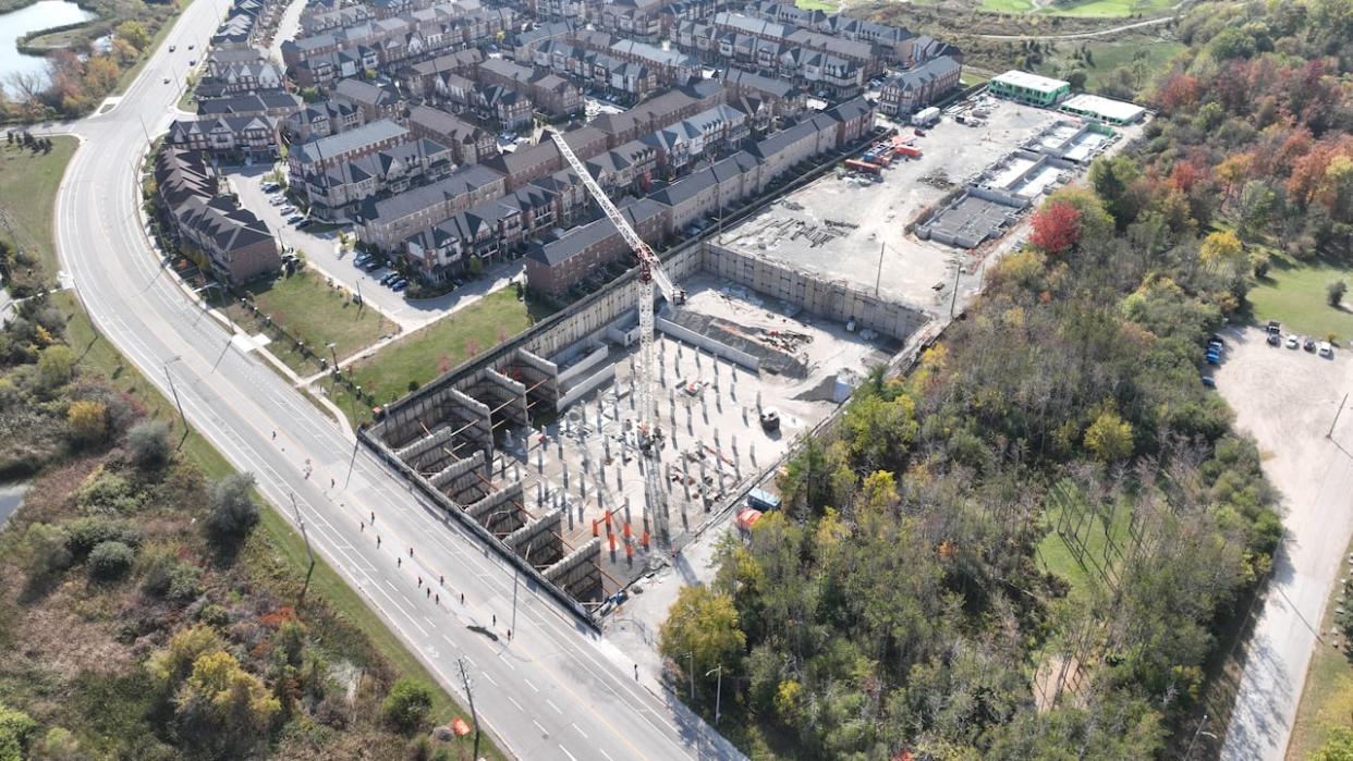 The rectangular construction side is where Vandyk Properties is building a 341-unit townhome development in Brampton. The delayed project was first opened to buyers in 2017 with an expected closing date of December 2020. (Ken Townsend/CBC - image credit)