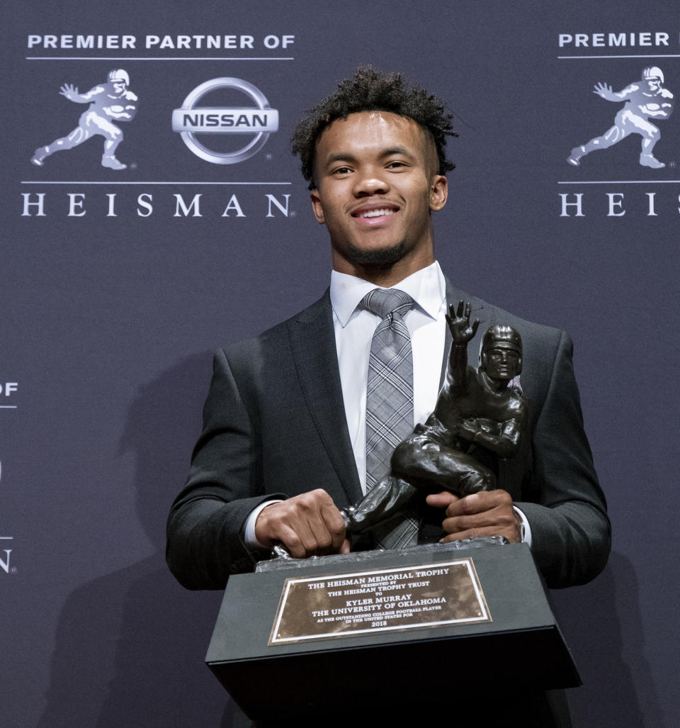 Oklahoma quarterback Kyler Murray poses with the Heisman Trophy after winning the award Saturday, Dec. 8, 2018, in New York. (AP Photo/Craig Ruttle)