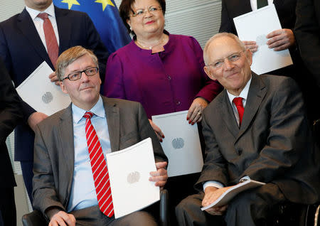 German parliamentary armed forces ombudsman Hans-Peter Bartels, whose job is to hear soldiers’ complaints, presents his annual report on the state of the German military to German Bundestag President Wolfgang Schaeuble in Berlin, Germany, February 20, 2018. REUTERS/Axel Schmidt