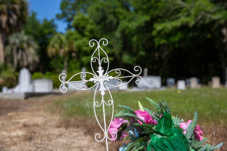 A cross decorates a grave at a cemetery in unincorporated Gardi, Georgia. In November of 2019 Javier Sanchez Mendoza, Jr. kidnapped a woman at knifepoint and drove her to the cemetery with plans of killing her.