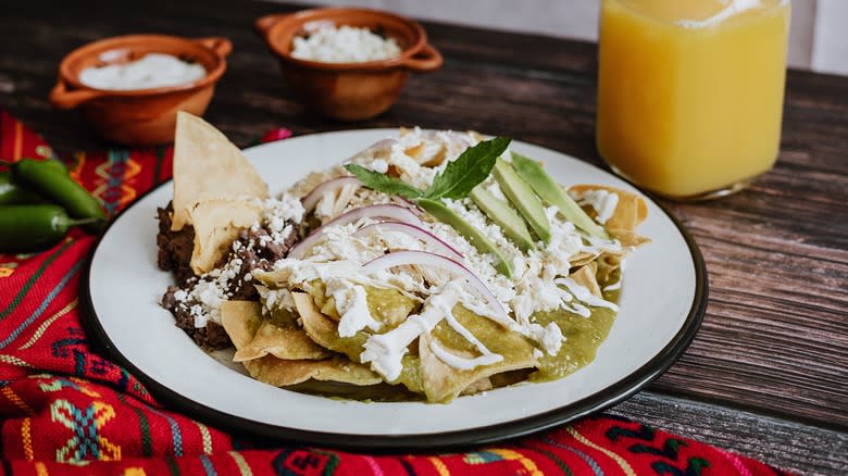 Chilaquiles topped with crema