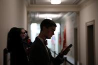 People wait in the public viewing line hours ahead of Trump impeachment inquiry testimony before a House Intelligence Committee hearing on Capitol Hill in Washington