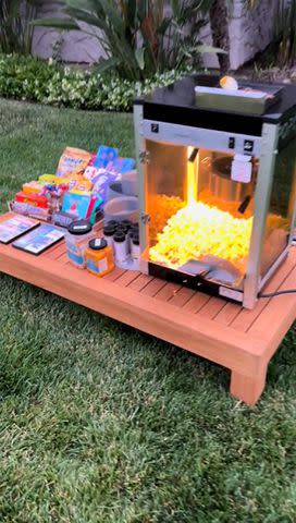 <p>Kourtney Kardashian TikTok</p> The family enjoyed an outdoor movie in the garden with a popcorn machine