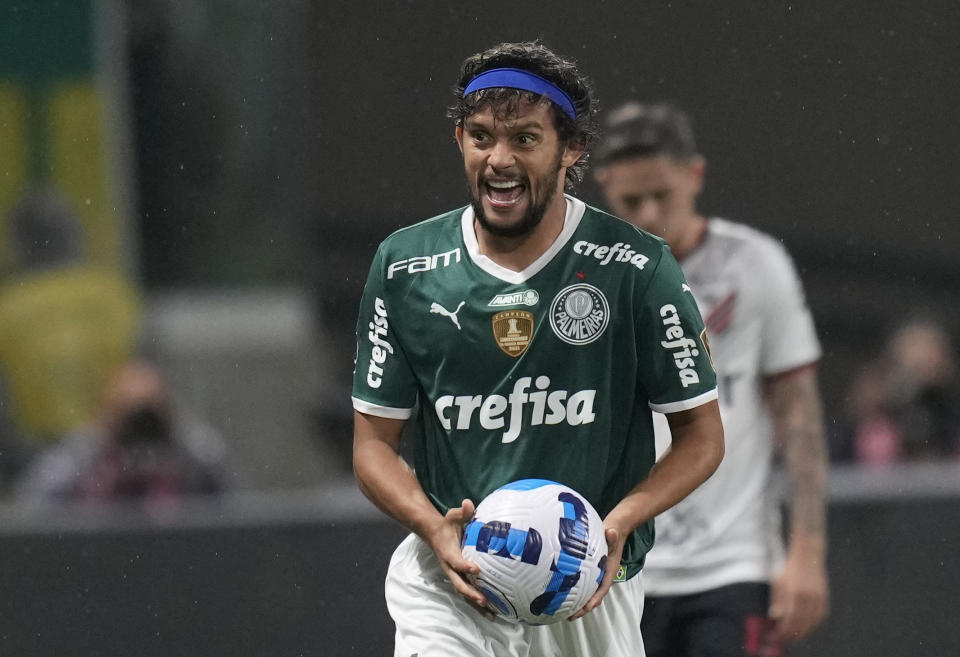 Gustavo Scarpa of Brazil's Palmeiras, celebrates scoring his side's opening goal against Brazil's Athletico Paranaense during a Copa Libertadores semifinal second leg soccer match at Allianz Parque stadium in Sao Paulo, Brazil, Tuesday, Sept. 6, 2022. (AP Photo/Andre Penner)