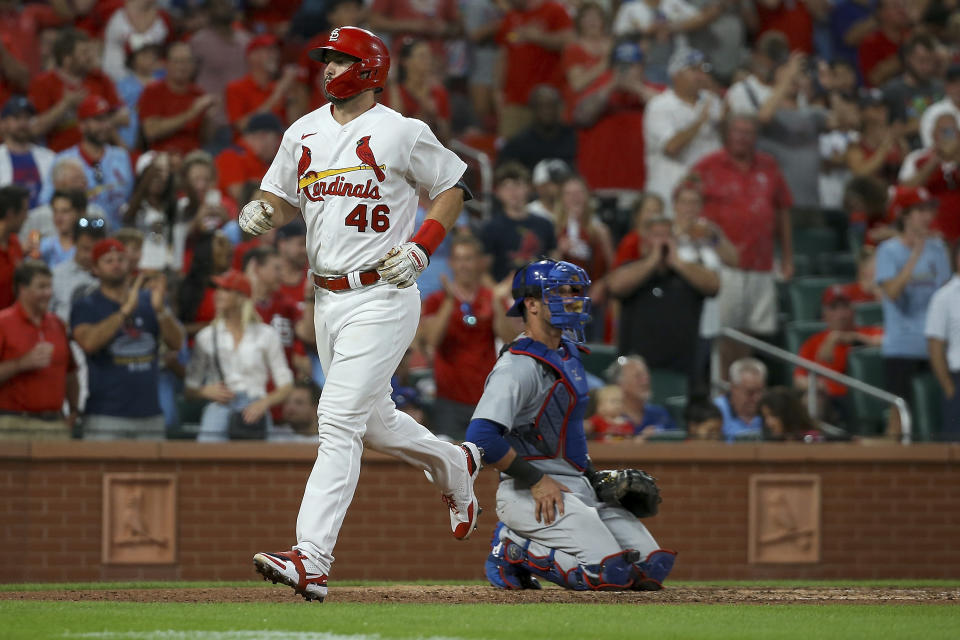 St. Louis Cardinals' Paul Goldschmidt heads to the dugout after scoring on a solo home run, next to Chicago Cubs catcher Yan Gomes during the fifth inning of a baseball game Tuesday, Aug. 2, 2022, in St. Louis. (AP Photo / Scott Kane)