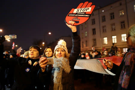 People gather to protest against plans to further restrict abortion laws, in Warsaw, Poland March 23, 2018. Agencja Gazeta/Agata Grzybowska via REUTERS