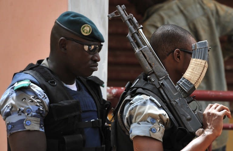 Malian soldiers stand guard at a military camp housing junta leader Amadou Sanogo in Kati near Bamako on March 30, 2012. Democracy around the world was in decline in 2012 for the seventh year in a row as the Arab Spring led nervous autocratic leaders to clamp down on any stirrings of dissent, a study said Wednesday