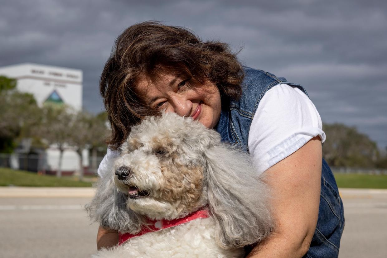 Diana Haneski and River, a therapy dog at Marjory Stoneman Douglas High School in Parkland, Florida.