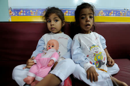 Girls rest as they receive treatment inside cancer ward of The Children's Hospital in Damascus, Syria February 20, 2017. Picture taken February 20, 2017. REUTERS/Omar Sanadiki