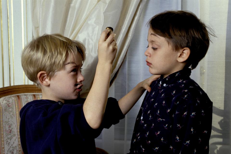 Paris, France - 11 December 1990, American actor Macaulay Culkin in his hotel room in Paris clowns around with his brother Kieran and paints his face with a wine cork.   (Photo by Francis Apesteguy/Getty Images)