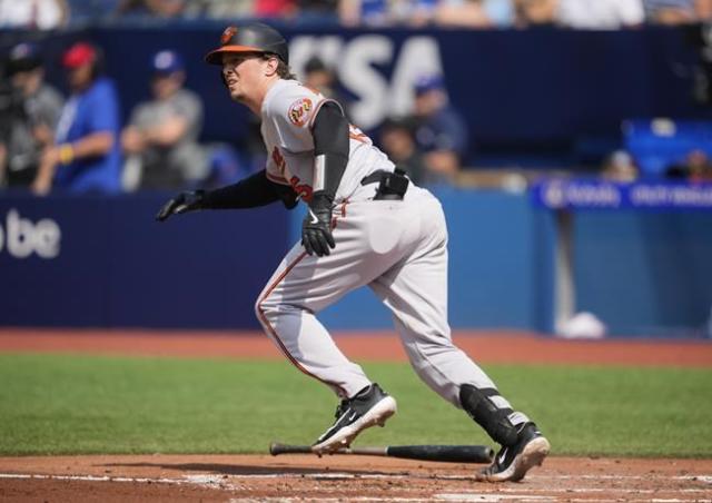 Baltimore Orioles' Adam Frazier and Blue Jays' Alek Manoah