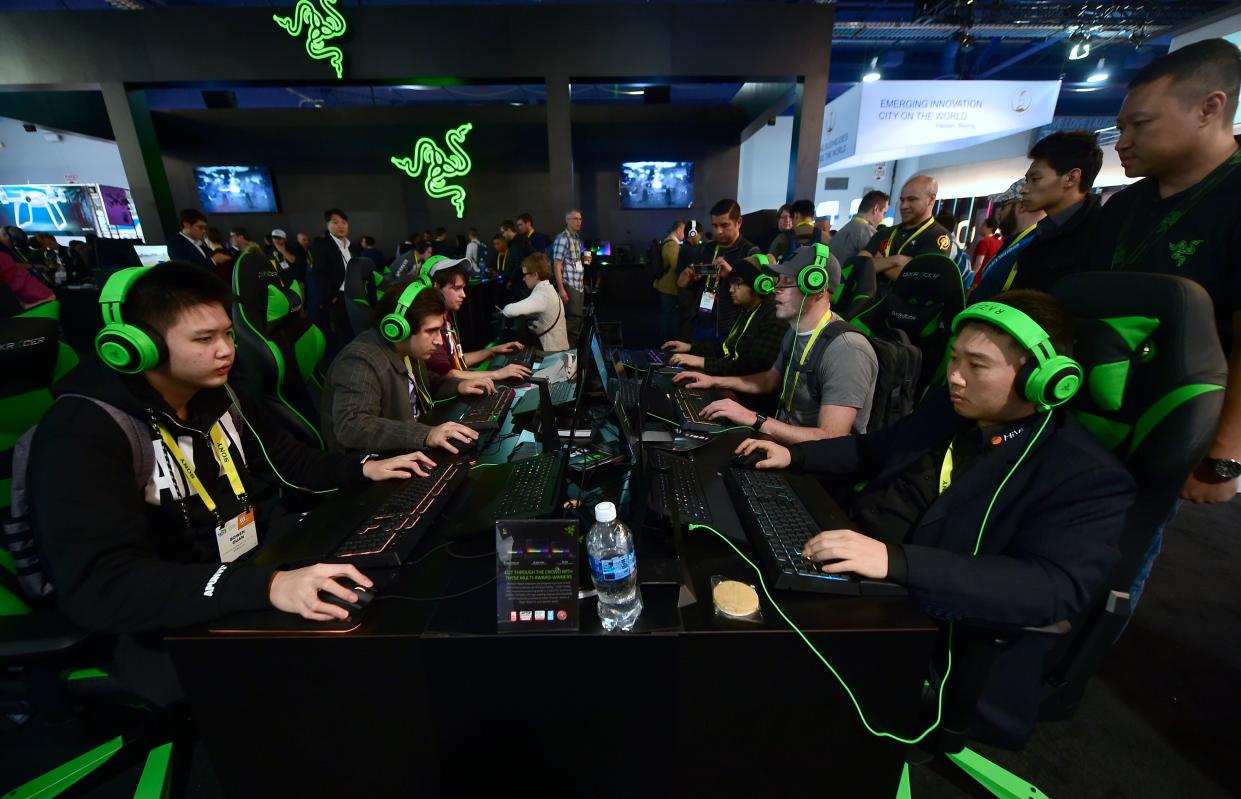 Gamers play 'Overland' by Blizzard using hardware from Razer during the 2017 Consumer Electronic Show (CES. Photo: FREDERIC J. BROWN/AFP via Getty Images