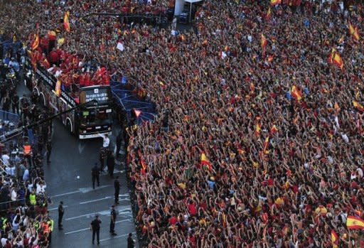 The Spanish national football team arrives on Cibeles Square after parading through Madrid, a day after it won the final match of the Euro 2012 championships 4-0 against Italy in Kiev