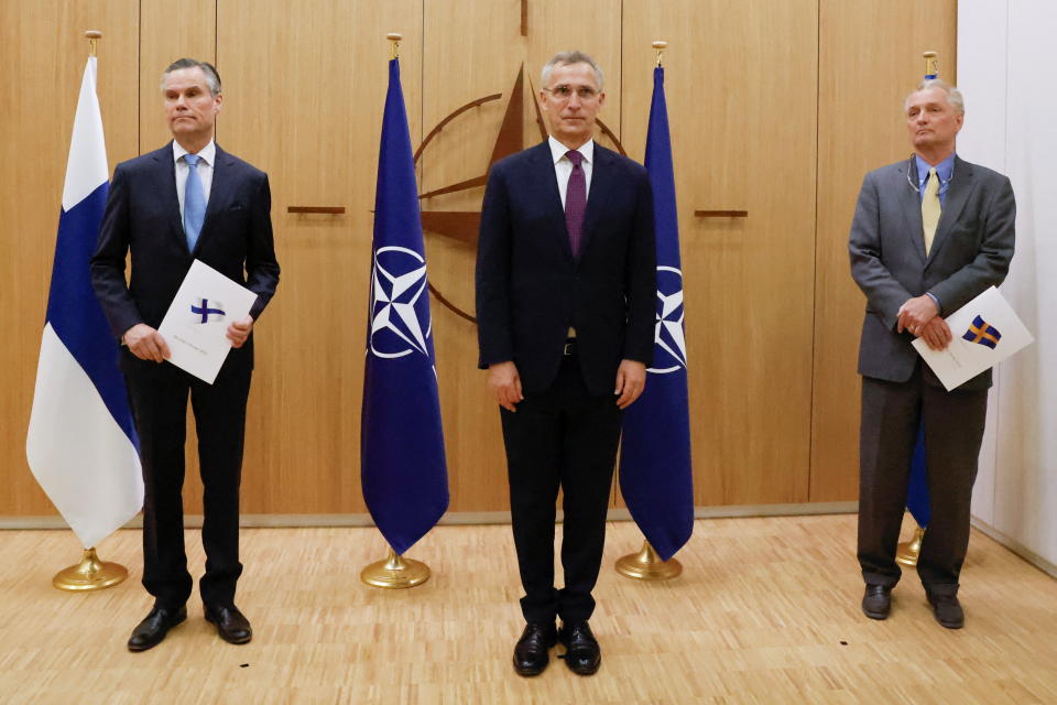 Finland's Ambassador to NATO Klaus Korhonen, NATO Secretary-General Jens Stoltenberg and Sweden's Ambassador to NATO Axel Wernhoff attend a ceremony to mark Sweden's and Finland's application for membership in Brussels, Belgium, May 18, 2022. REUTERS/Johanna Geron/Pool