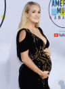 She’s glowing! Carrie was all smiles while pregnant with her second child, Jacob Bryan, whom she gave birth to in 2019. She and Mike also share son Isaiah.