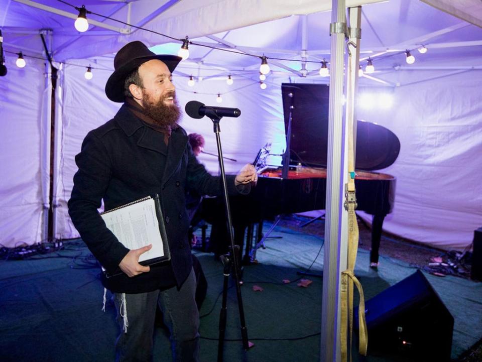  Rabbi Mendy Korer, co-CEO at Chabad Islington, talking on stage at a previous Islington menorah lighting (PA)