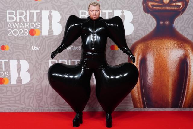 Sam Smith makes a bold fashion statement in a inflatable black latex  jumpsuit at the BRIT Awards