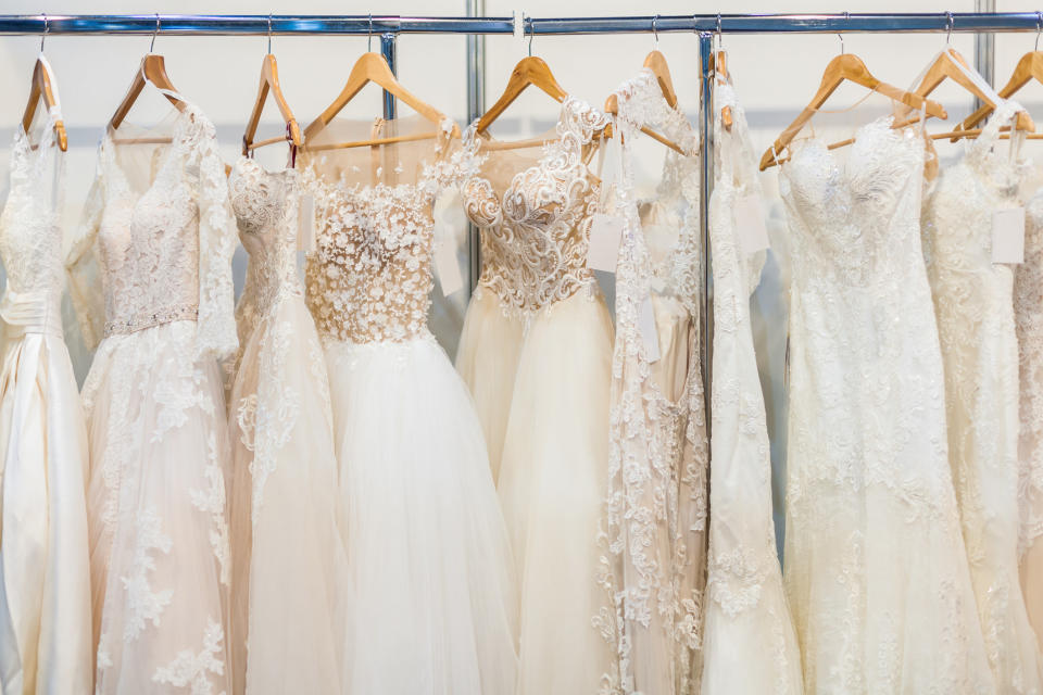 Wedding dresses hanging up in a store