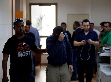 FILE PHOTO: An U.S.-Israeli teen who was arrested in Israel on suspicion of making bomb threats against Jewish community centres in the United States, Australia and New Zealand over the past three month, is seen before the start of a remand hearing at Magistrate's Court in Rishon Lezion, Israel March 23, 2017. REUTERS/Baz Ratner/File Photo