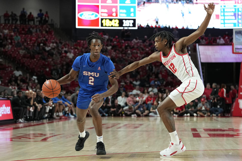 SMU guard Jalen Smith (2) is defended by Houston guard Tramon Mark (12) during the first half of an NCAA college basketball game, Thursday, Jan. 5, 2023, in Houston. (AP Photo/Kevin M. Cox)