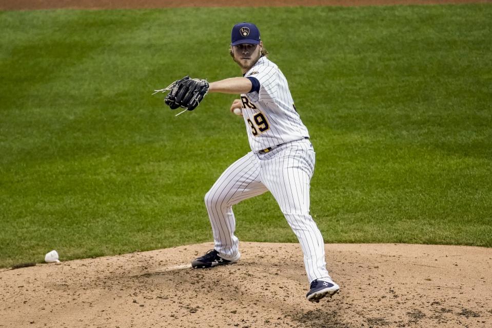 Milwaukee Brewers relief pitcher Corbin Burnes throws during the fifth inning of a baseball game against the Cincinnati Reds Saturday, Aug. 8, 2020, in Milwaukee. (AP Photo/Morry Gash)