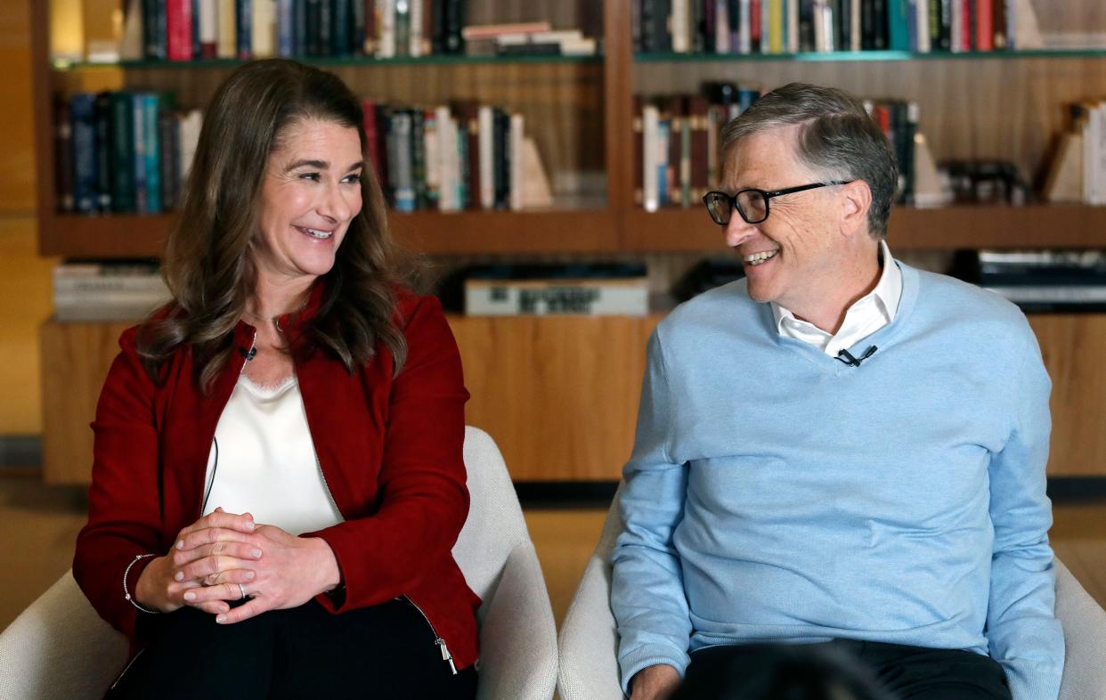 In this Feb. 1, 2019, file photo, Bill and Melinda Gates smile at each other during an interview in Kirkland, Wash.