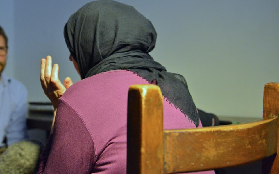 Valeria Collina (from behind with headscarf), mother of Youssef Zaghba one of the London knife attack terrorists, speaks to the press in her home 35 Km from Bologna - Credit: Chris Warde-Jones