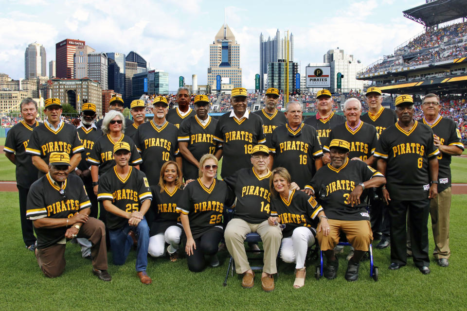 Members of the 1979 Pittsburgh Pirates World Championship team and people involved with the team pose for a photo after a pre-game ceremony honoring the team before a baseball game between the Pittsburgh Pirates and the Philadelphia Phillies in Pittsburgh, Saturday, July 20, 2019. (AP Photo/Gene J. Puskar)