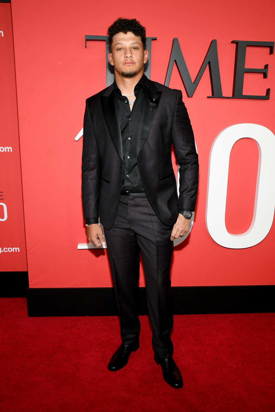 Patrick Mahomes Slips On Black Leather Boots for Time 100 Gala 2024