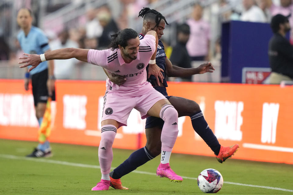 Inter Miami forward Leonardo Campana, left, and New England Revolution forward DeJuan Jones go for the ball during the first half of an MLS soccer match Saturday, May 13, 2023, in Fort Lauderdale, Fla. (AP Photo/Lynne Sladky)