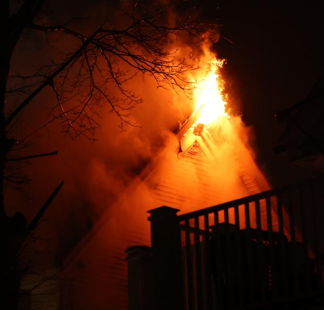 Brockton firefighters battle a 3-alarm fire that rekindled at a multi-family home at 168 Bartlett St. on Friday, Jan. 6, 2023.
