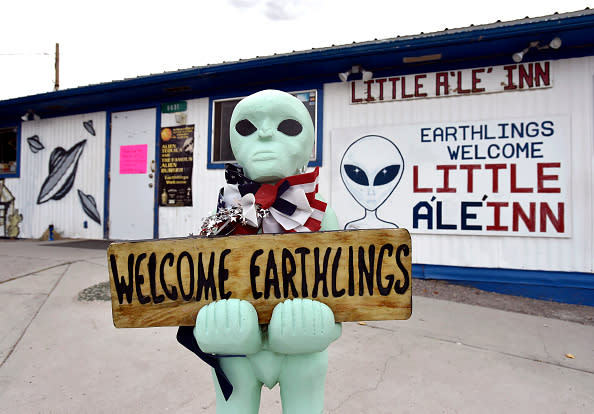 An alien-like statue displays a sign welcoming guests to the Little A'le'Inn restaurant and gift shop in Rachel, Nevada on July 22, 2019. | David Becker—Getty Images
