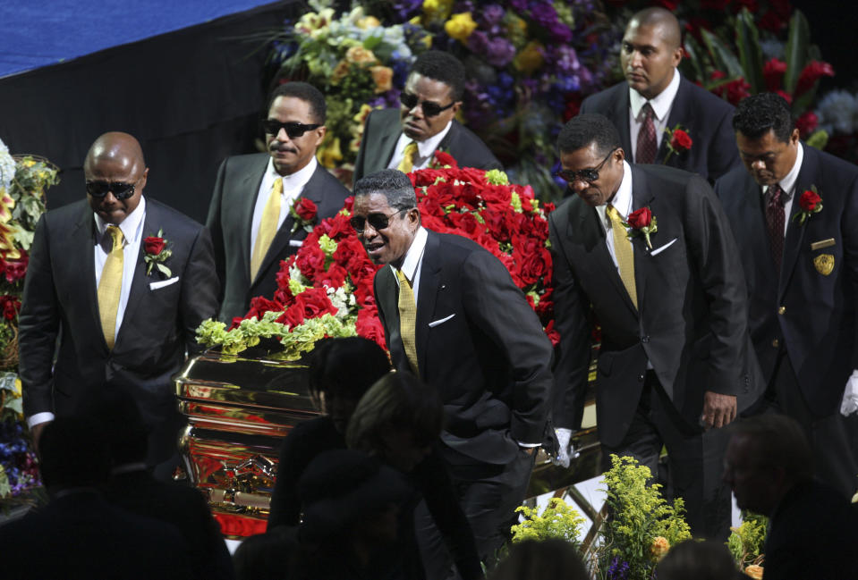 FILE - In this July 7, 2009 file photo, the Jackson brothers, from back left, Randy Jackson, Marlon Jackson and Tito Jackson, and from front left, Jermaine Jackson and Jackie Jackson carry the casket at the memorial service for the late pop star Michael Jackson in Los Angeles. Michael Jackson died on June 25, 2009. (AP Photo/Mario Anzuoni, Pool file)