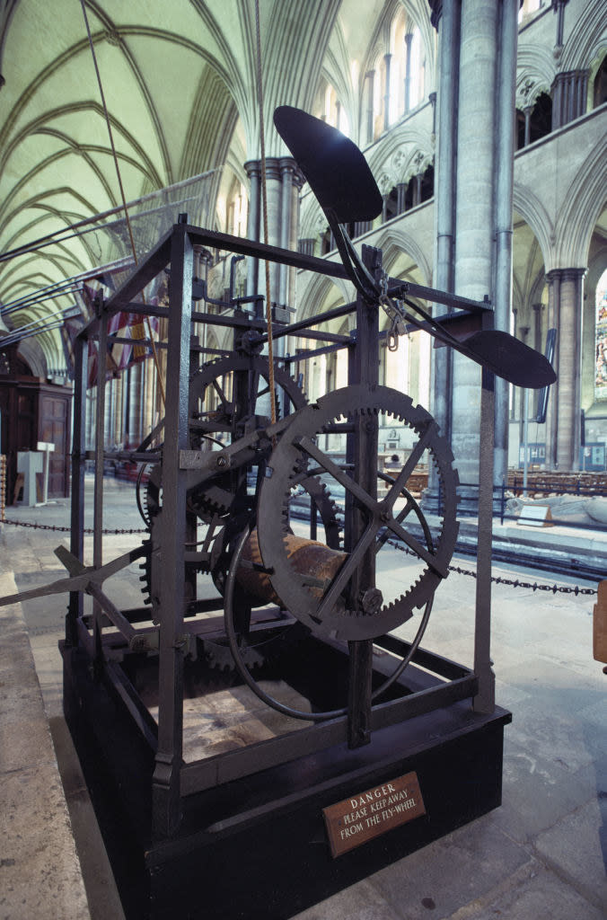 clock inside a building in a case that says to keep away