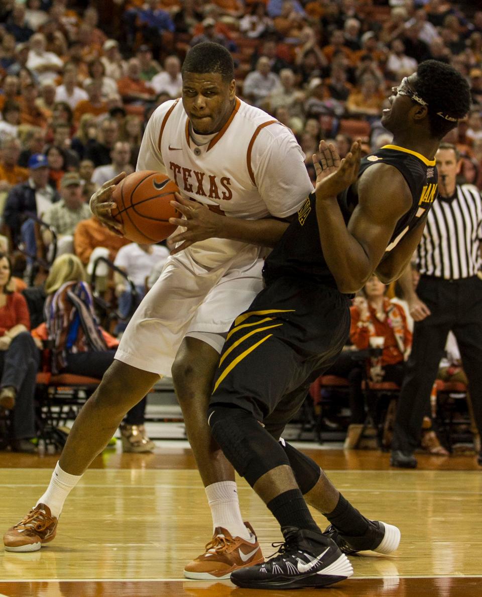 Former Texas standout Cameron Ridley, banging into West Virginia's Devin Williams at the Erwin Center in 2014, is on this week's TBT regional team made up of former UT players.