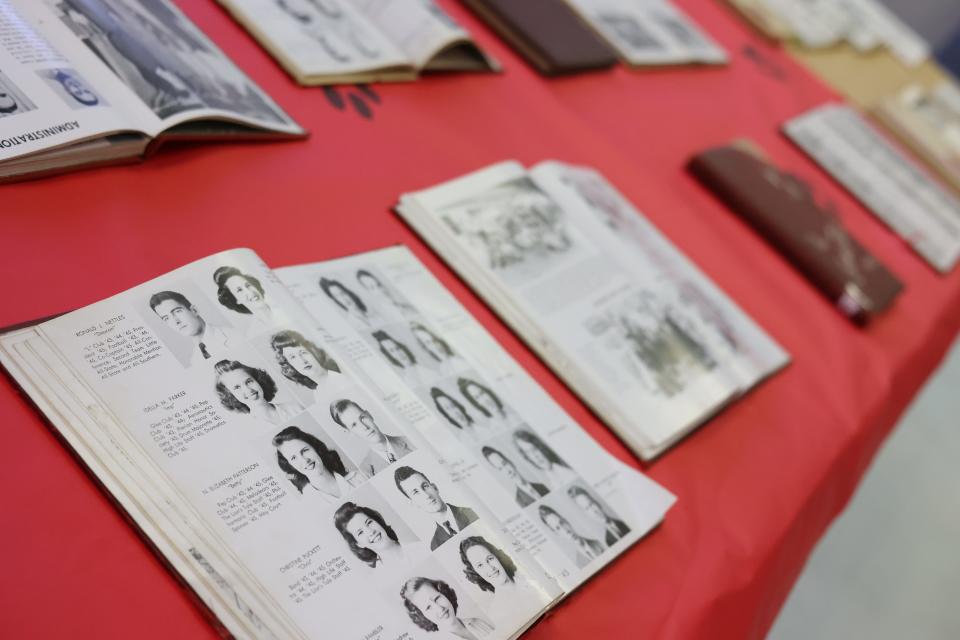 Yearbooks and other memorabilia on a table in the Leon High School cafeteria at a reunion for the class of 1951 Saturday, Sept. 17, 2022.