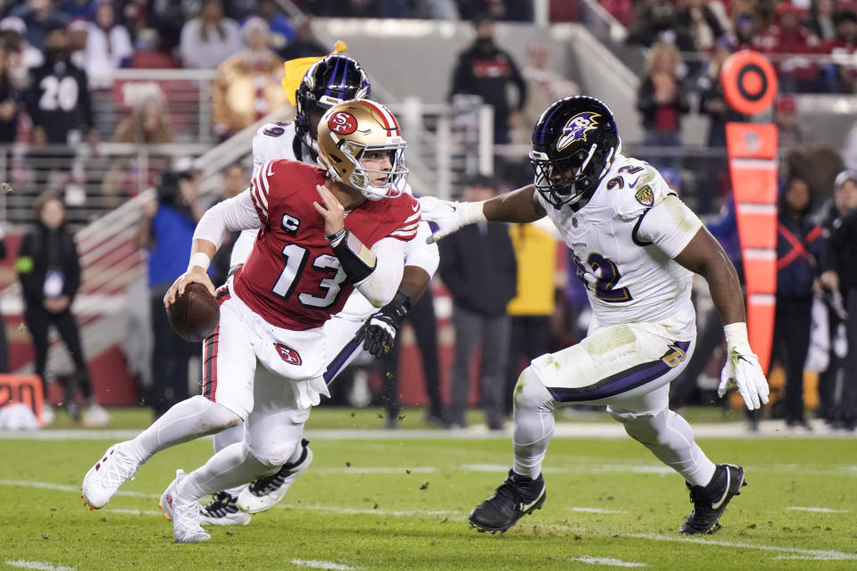 SANTA CLARA, CALIFORNIA – DECEMBER 25: Brock Purdy #13 of the San Francisco 49ers attempts a pass while pressured by Justin Madubuike #92 and Odafe Oweh #99 of the Baltimore Ravens during the second quarter at Levi’s Stadium on December 25, 2023 in Santa Clara, California. (Photo by Loren Elliott/Getty Images)