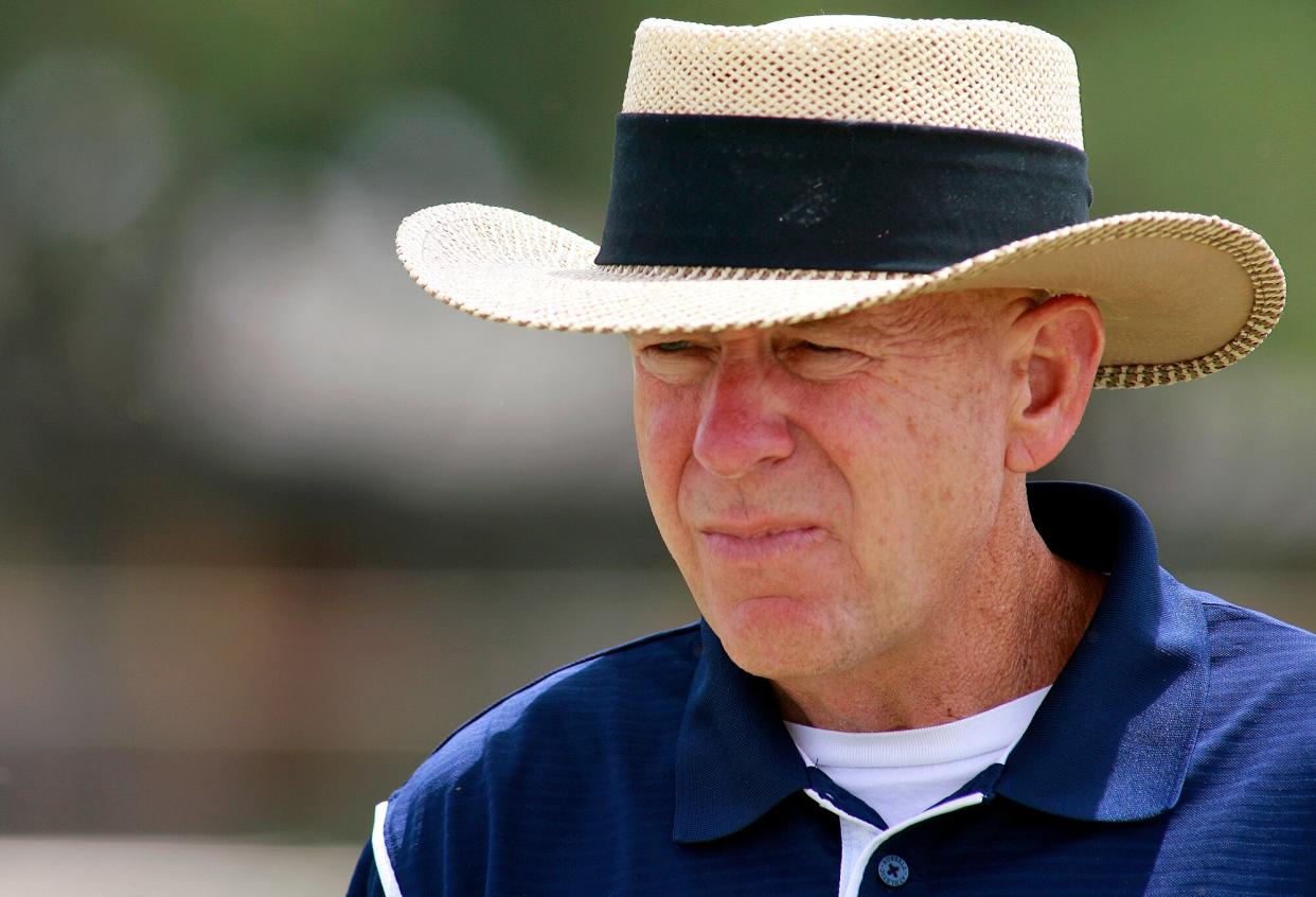 Odessa Permian head coach Gary Gaines walks off the practice field after a high school football workout in Odessa, Texas. Gaines, the 63-year-old at the center of the "Friday Night Lights" book and film, has left the school's sideline for the last time after announcing his resignation on Tuesday, Dec. 18, 2012.