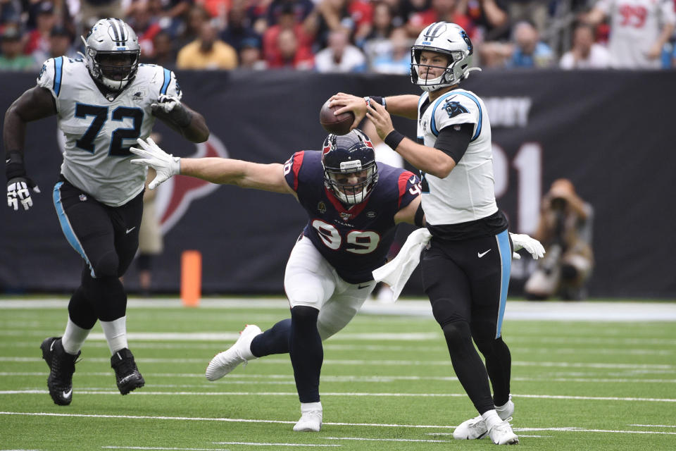 Carolina Panthers quarterback Kyle Allen (7) is pressured by Houston Texans defensive end J.J. Watt (99) during the first half of an NFL football game Sunday, Sept. 29, 2019, in Houston. (AP Photo/Eric Christian Smith)