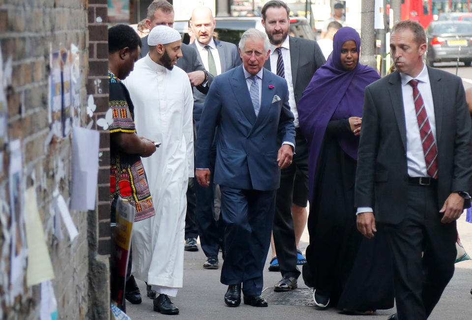 King Charles III, center, speaks to Muslim leader Mohammed Mahmoud as he visits the Muslim Welfare House, Finsbury Park, to meet members of the local community and hear about the community response following the recent extremist attacks in London, on June 21, 2017.<span class="copyright">Frank Augstein—AP</span>