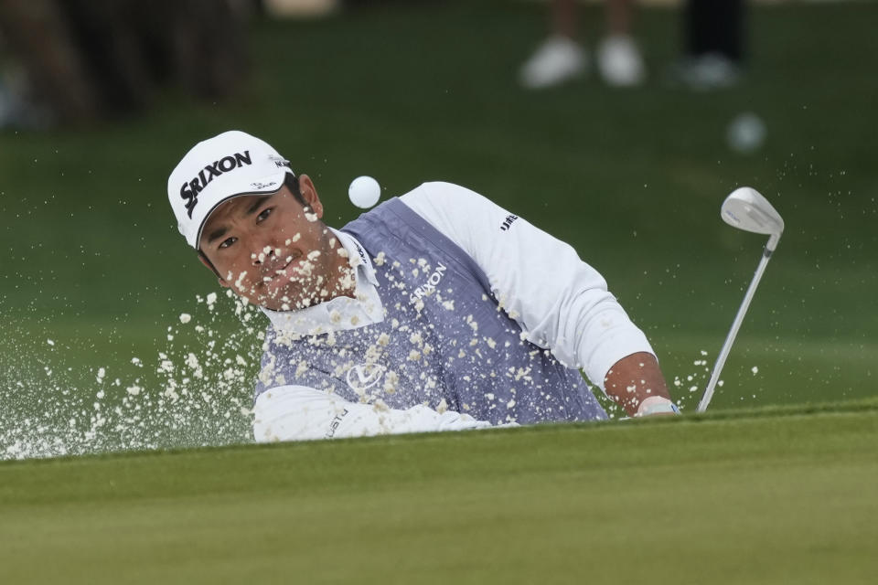 Hideki Matsuyama, of Japan, hits out of a greenside bunker on the 15th hole during the second round of the Phoenix Open golf tournament Friday, Feb. 9, 2024, in Scottsdale, Ariz. (AP Photo/Ross D. Franklin)