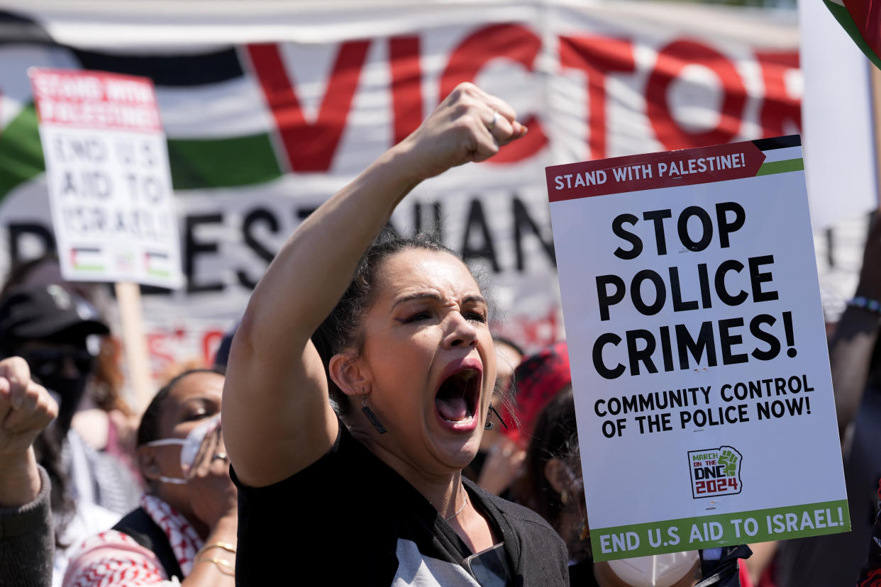 A protester yells during a demonstration before a march to the Democratic National Convention Monday, Aug. 19, 2024, in Chicago. (AP Photo/Alex Brandon)