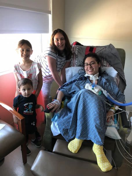 PHOTO: Jazmin Kirkland, of Texas, poses with her three children while hospitalized during her battle with COVID-19. (Kody Kirkland)