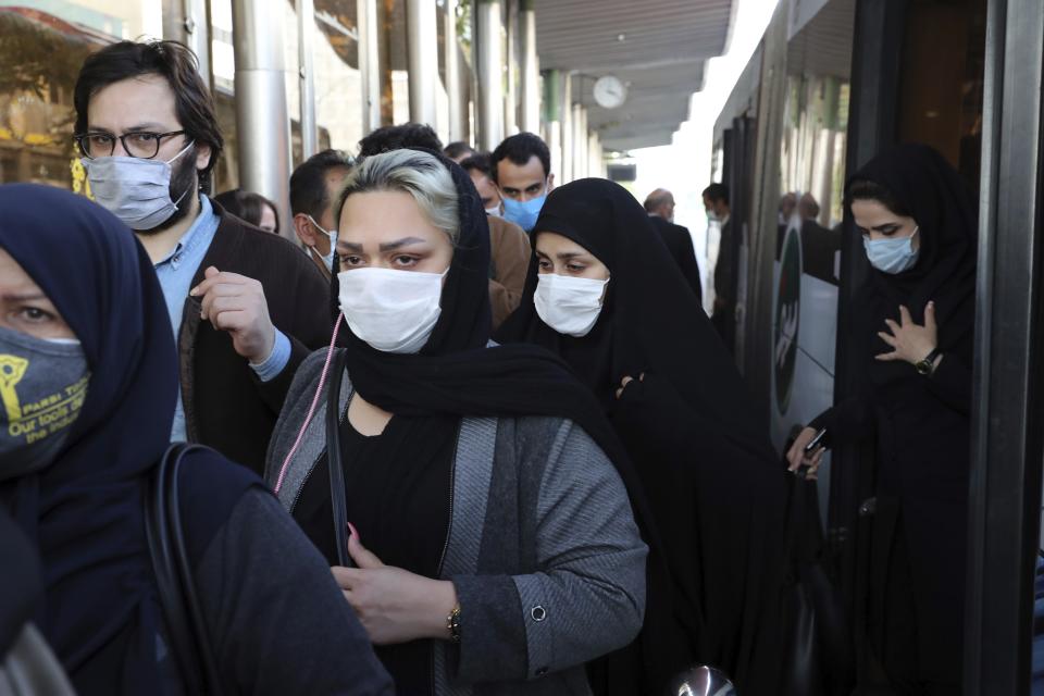 FILE - In this Sunday, Oct. 11, 2020 file photo, people wear protective face masks to help prevent the spread of the coronavirus in downtown Tehran, Iran. For the second day in a row, Iran announced Monday its highest single-day death toll from the coronavirus with 272 people killed. The announcement by Health Ministry spokeswoman Sima Sadat Lari saw Iran also give its single-day highest count of new cases with 4,206 new patients.(AP Photo/Ebrahim Noroozi, File)