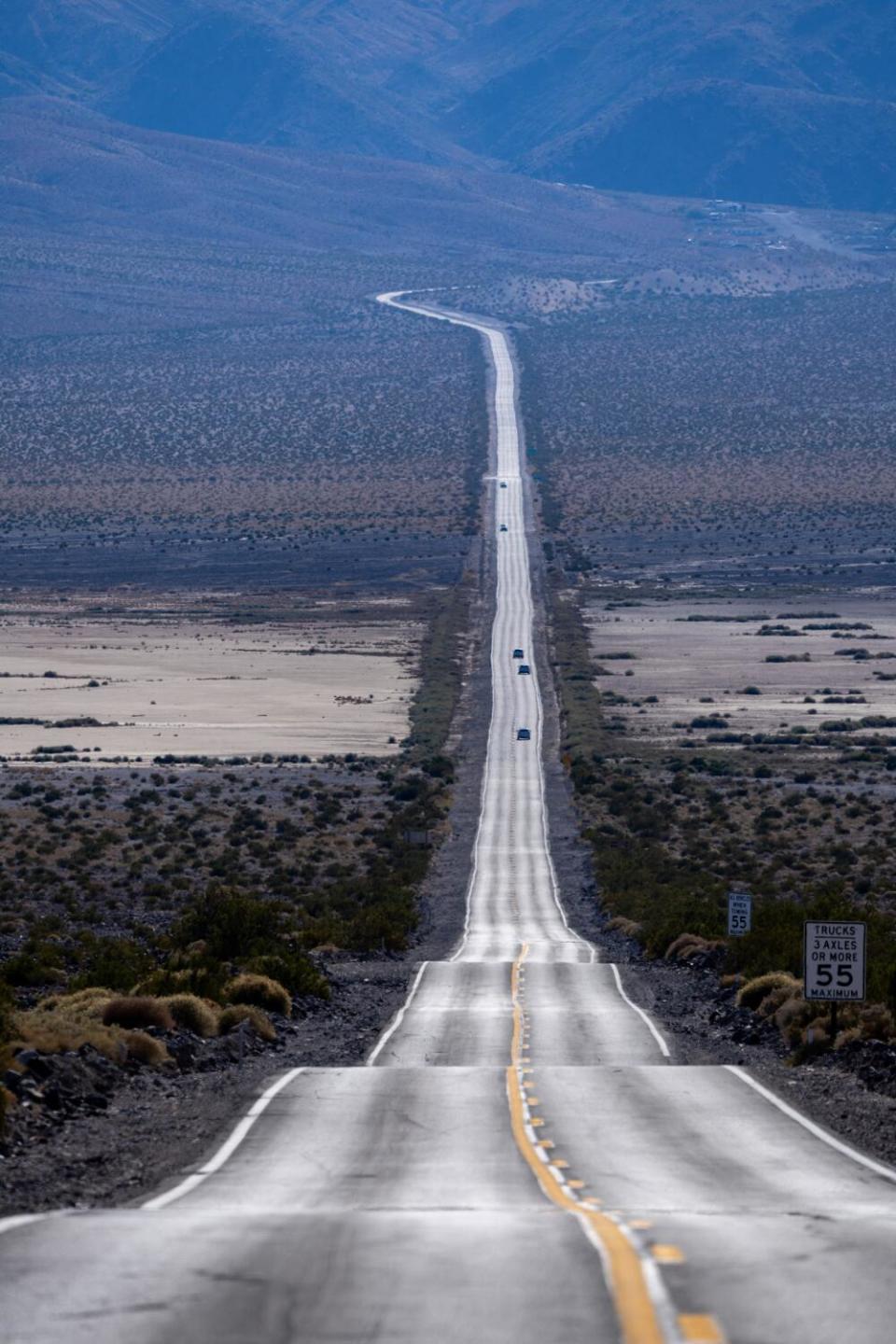 A road cuts through a desert.