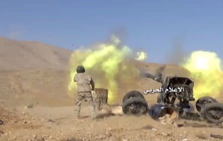 A still image taken on August 19, 2017 from a footage of Hezbollah military handout shows a Hezbollah artillery firing at western Qalamoun, Syria. Hezbollah Military Handout via Reuters TV.