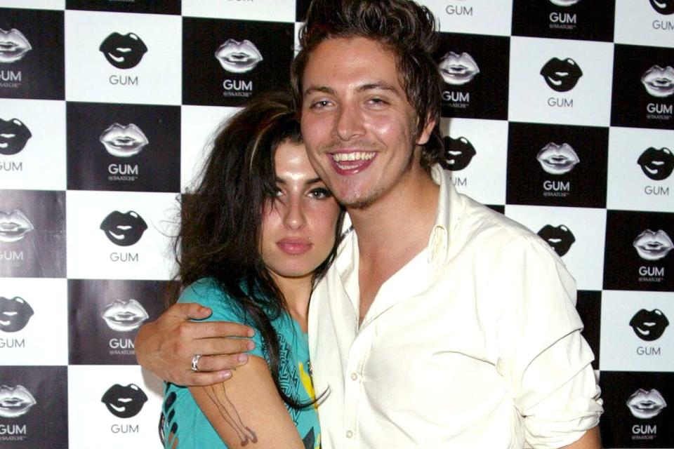 <p>Tim Whitby/WireImage</p> Amy Winehouse and Tyler James 