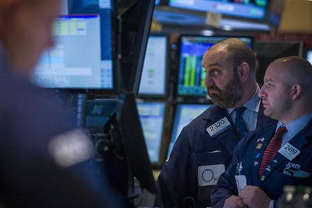 Traders work on the floor of the New York Stock Exchange January 10, 2014. REUTERS/Brendan McDermid