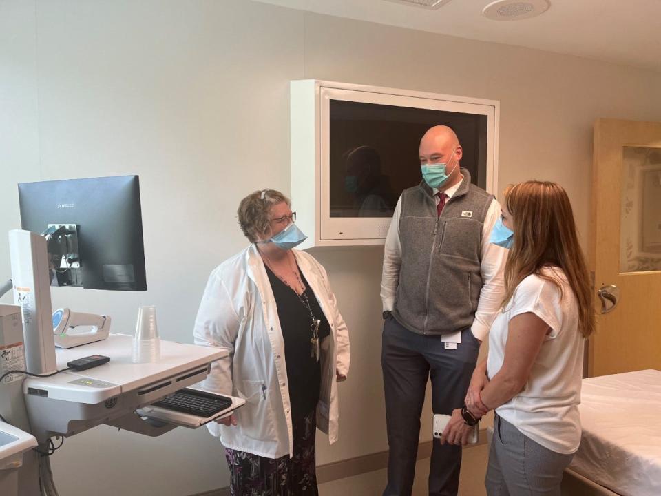 Cindy Cunningham, behavioral health nurse manager,  Justin Looser, New Hampshire market administrative director of behavioral health services, and Liza Hutton, behavioral health clinician, meet in Frisbie Memorial Hospital's new behavioral health pod.